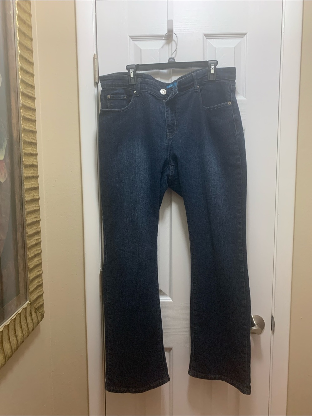 Women’s straight leg dark jeans.